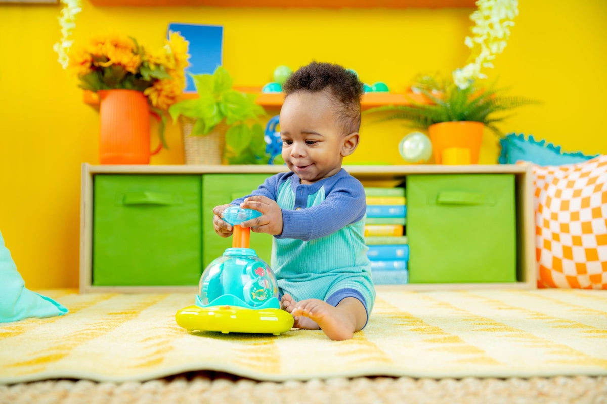 Bright Starts Press and Glow Spinner Toy